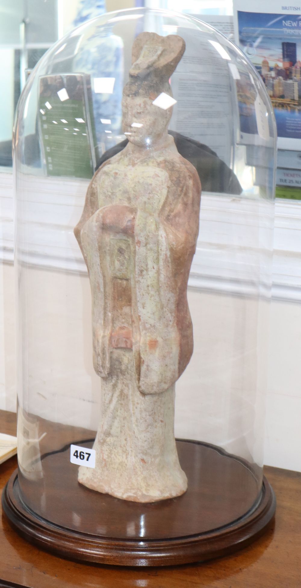 A large Chinese painted pottery figure of an official, Tang dynasty or later with glass dome, with certificate